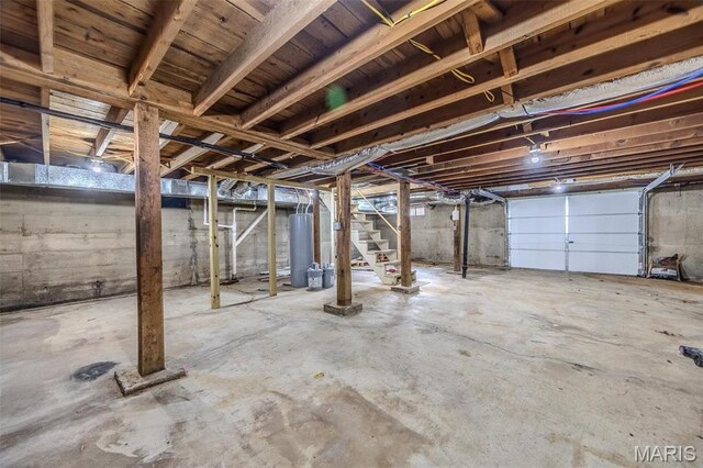 1400 S Jackson St, Salem, MO 65560 - unfinished basement featuring stairs and water heater
