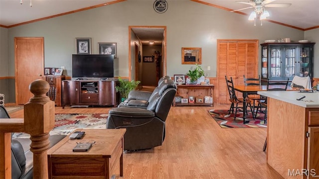 2630 Melody Ln, Cuba, MO 65453 - living area with vaulted ceiling, light wood-style floors, ceiling fan, and crown molding