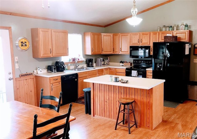 2630 Melody Ln, Cuba, MO 65453 - kitchen with black appliances, a sink, light wood-style floors, light countertops, and crown molding