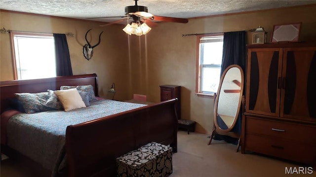 2630 Melody Ln, Cuba, MO 65453 - bedroom featuring multiple windows, light carpet, a textured ceiling, and a ceiling fan