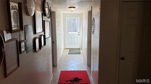 2630 Melody Ln, Cuba, MO 65453 - hall featuring light tile patterned flooring and a textured ceiling
