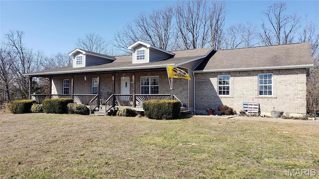2630 Melody Ln, Cuba, MO 65453 - view of front facade with brick siding, a front lawn, and a porch
