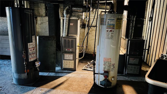utility room featuring gas water heater