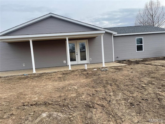 806 E Dover St, Monroe City, MO 63456 - rear view of property featuring french doors and roof with shingles