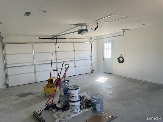 806 E Dover St, Monroe City, MO 63456 - garage featuring a garage door opener and baseboards