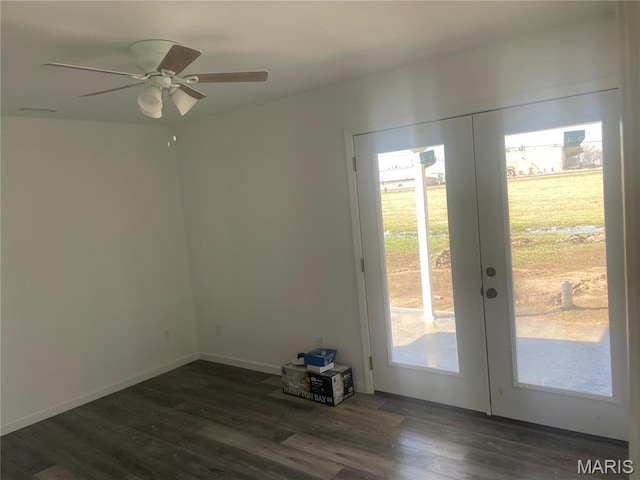 806 E Dover St, Monroe City, MO 63456 - entryway with dark wood finished floors, french doors, a ceiling fan, and baseboards