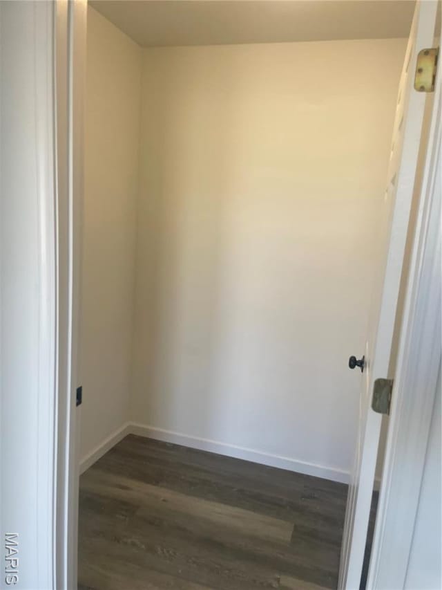 806 E Dover St, Monroe City, MO 63456 - unfurnished room featuring dark wood-style floors and baseboards