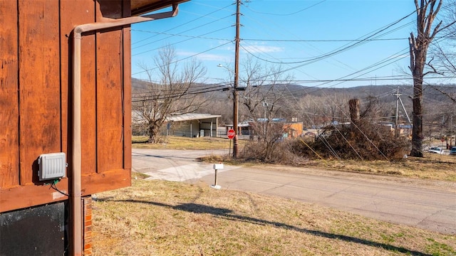 528 N Shepherd St, Ironton, MO 63650 - view of asphalt road featuring traffic signs, street lights, and a mountain view