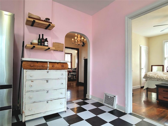 305 Williams St, Washington, MO 63090 - corridor with dark floors, arched walkways, a chandelier, and baseboards