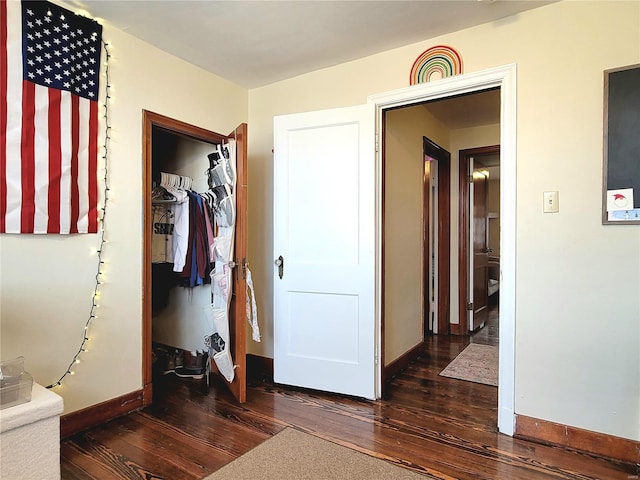 305 Williams St, Washington, MO 63090 - bedroom featuring hardwood / wood-style floors, baseboards, and a closet