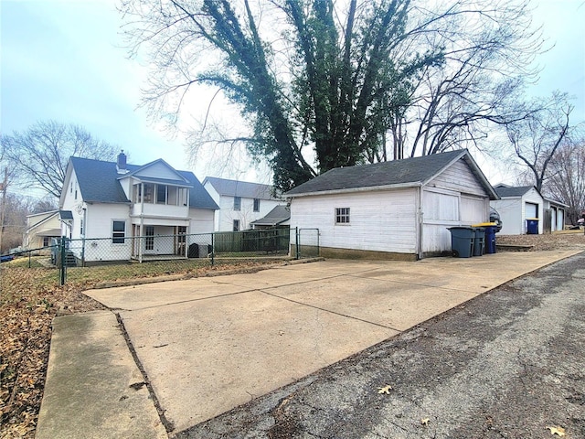 305 Williams St, Washington, MO 63090 - back of property with fence, an outdoor structure, a chimney, and a residential view