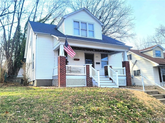 305 Williams St, Washington, MO 63090 - view of front of house with a porch and a front lawn