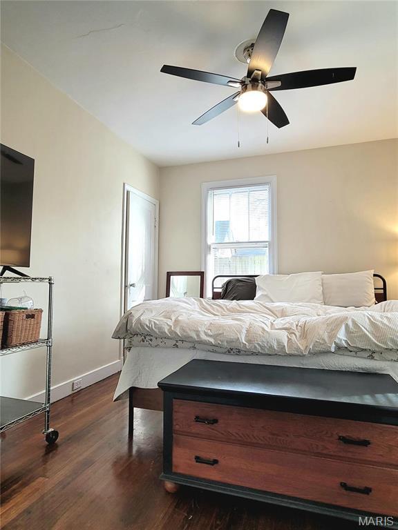 305 Williams St, Washington, MO 63090 - bedroom with dark wood finished floors and a ceiling fan