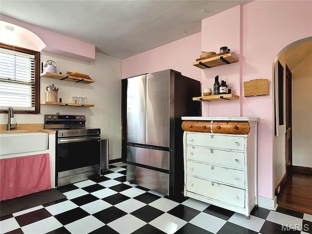305 Williams St, Washington, MO 63090 - kitchen with stainless steel appliances, open shelves, and dark flooring