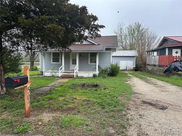 507 N Knob St, Ironton, MO 63650 - bungalow-style home featuring covered porch, driveway, and a shingled roof