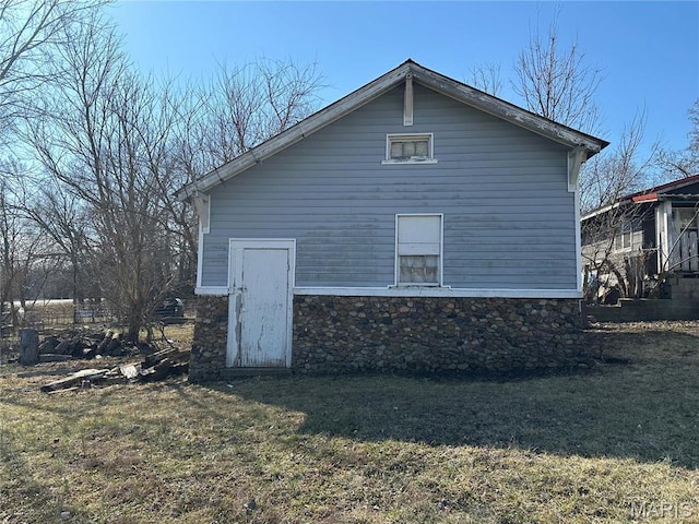 507 N Knob St, Ironton, MO 63650 - view of home's exterior with a lawn and stone siding