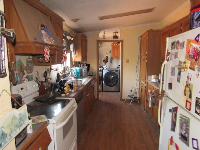 kitchen featuring white appliances, ornamental molding, washer and dryer, dark wood-type flooring, and brown cabinets