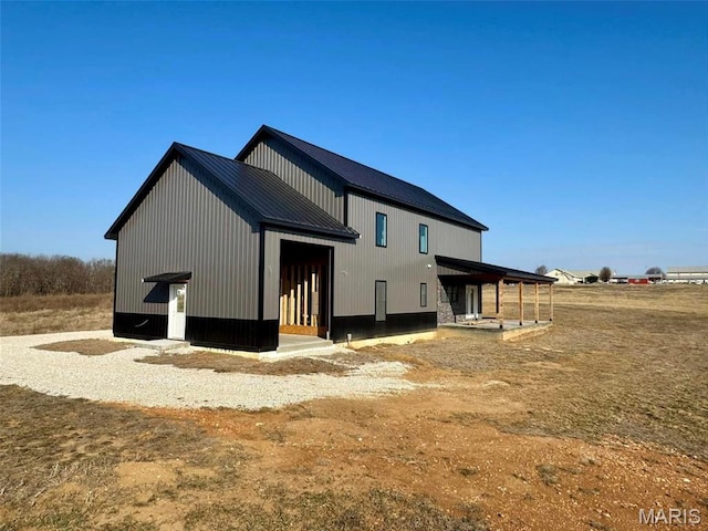 4727 Walnut Creek Dr, Palmyra, MO 63461 - back of property featuring metal roof