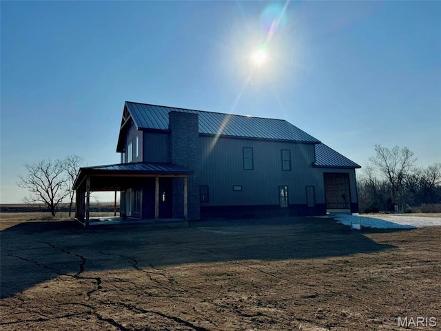 4727 Walnut Creek Dr, Palmyra, MO 63461 - back of house with a standing seam roof and metal roof