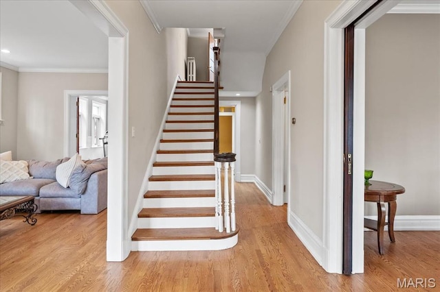 6230 Waterman Ave, Saint Louis, MO 63130 - stairs with wood finished floors, baseboards, ornamental molding, and recessed lighting