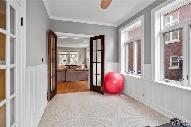 6230 Waterman Ave, Saint Louis, MO 63130 - workout area featuring french doors, carpet floors, crown molding, and a wainscoted wall