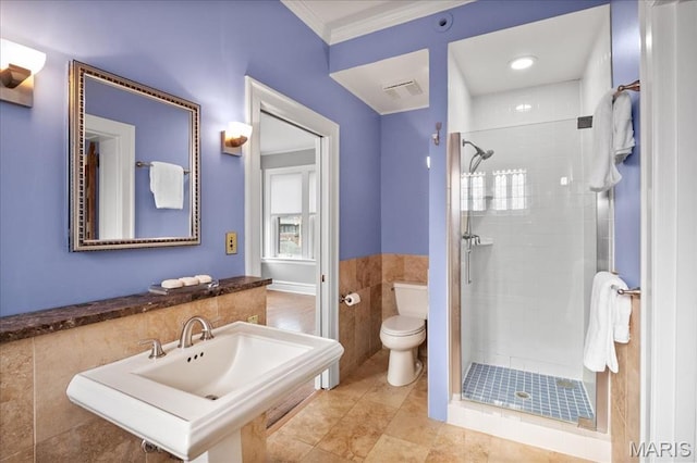 6230 Waterman Ave, Saint Louis, MO 63130 - full bath with toilet, a shower stall, ornamental molding, a sink, and tile walls