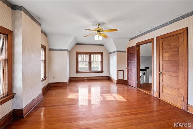 6230 Waterman Ave, Saint Louis, MO 63130 - bonus room with wallpapered walls, ceiling fan, wood finished floors, baseboards, and lofted ceiling