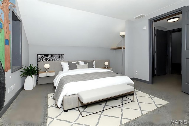 bedroom featuring baseboards and lofted ceiling