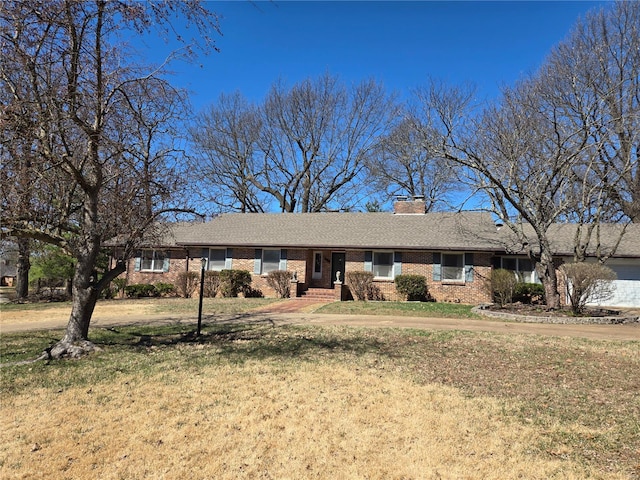 400 Smith Rd, Lebanon, MO 65536 - ranch-style house with brick siding, a front yard, and a chimney