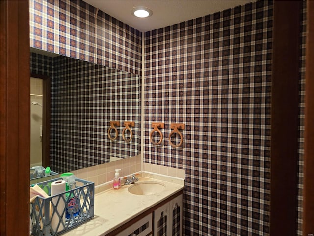 400 Smith Rd, Lebanon, MO 65536 - bathroom with wallpapered walls, vanity, and backsplash