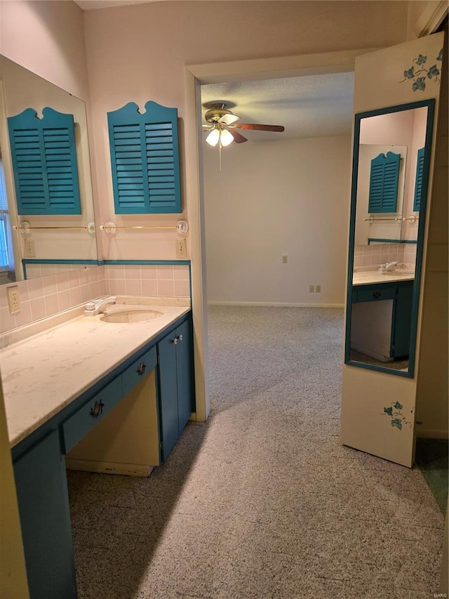 400 Smith Rd, Lebanon, MO 65536 - bathroom with ceiling fan, decorative backsplash, vanity, and baseboards