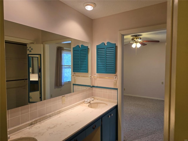 400 Smith Rd, Lebanon, MO 65536 - bathroom with double vanity, a ceiling fan, and a textured ceiling
