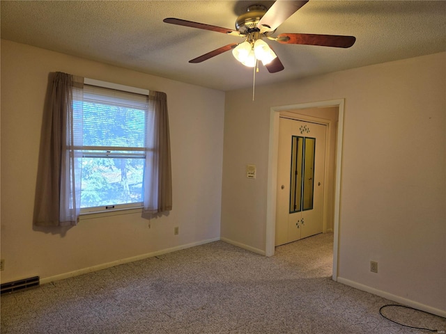 400 Smith Rd, Lebanon, MO 65536 - carpeted spare room featuring a ceiling fan, a textured ceiling, and baseboards