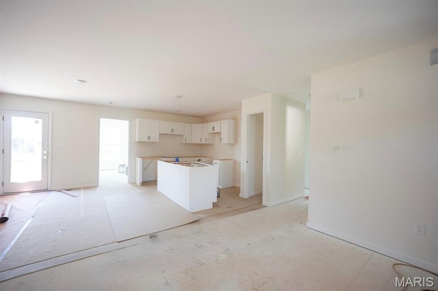1016 Fox Manor Ct, Staunton, IL 62088 - kitchen featuring white cabinetry and a kitchen island