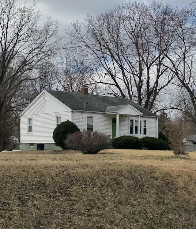 view of home's exterior with a chimney