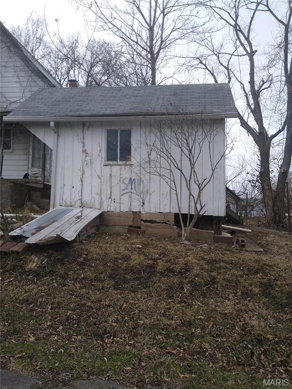 607 E Hancock St, Steeleville, IL 62288 - view of property exterior with a chimney