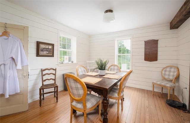 19530 County Road 3620, St James, MO 65559 - dining room featuring light wood-type flooring and wood walls
