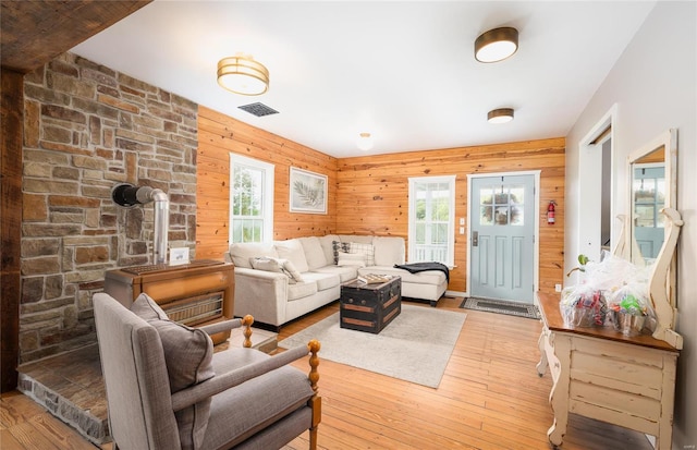 19530 County Road 3620, St James, MO 65559 - living area with healthy amount of natural light, light wood-style flooring, and wooden walls