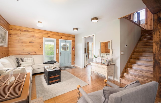 19530 County Road 3620, St James, MO 65559 - living room with stairway, wooden walls, baseboards, wood-type flooring, and healthy amount of natural light