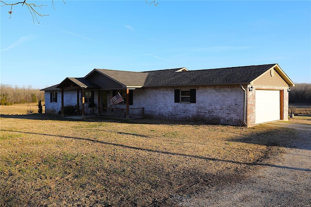 1988 Ripley Route Cc, Doniphan, MO 63935 - ranch-style house featuring a garage, brick siding, dirt driveway, a porch, and a front yard