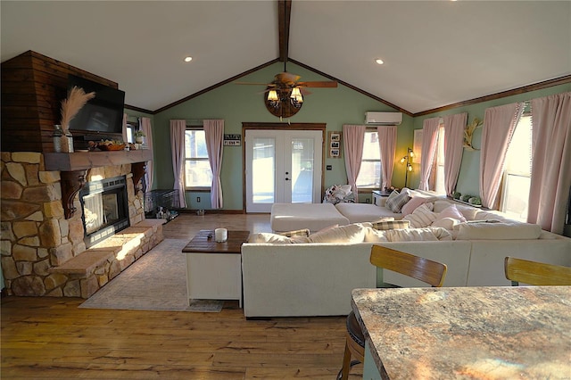 1988 Ripley Route Cc, Doniphan, MO 63935 - living area featuring an AC wall unit, hardwood / wood-style floors, a fireplace, ceiling fan, and crown molding