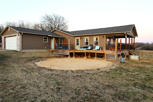 1988 Ripley Route Cc, Doniphan, MO 63935 - back of house featuring a deck, an attached garage, and roof with shingles