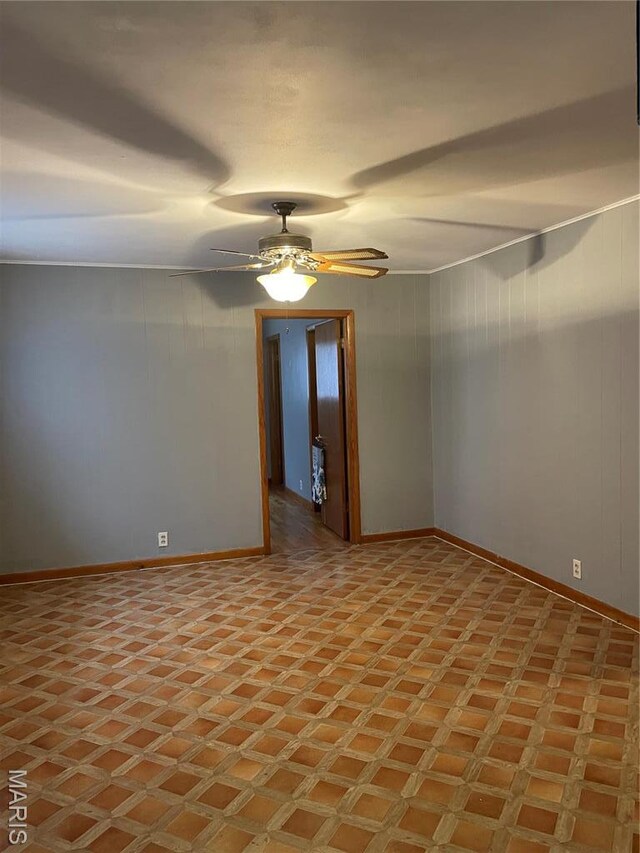 1415 Woodland Rd, Poplar Bluff, MO 63901 - spare room featuring baseboards and ceiling fan