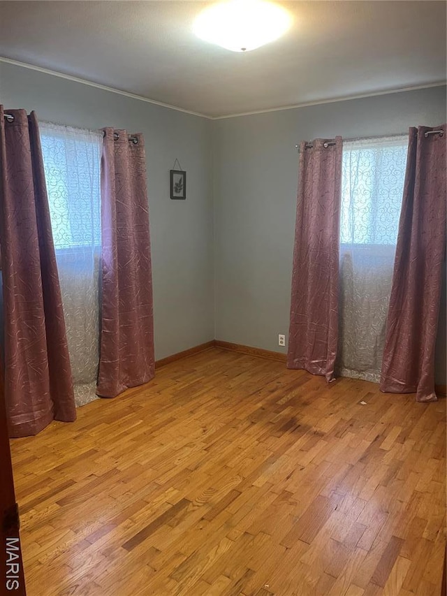 1415 Woodland Rd, Poplar Bluff, MO 63901 - unfurnished room featuring wood finished floors and baseboards