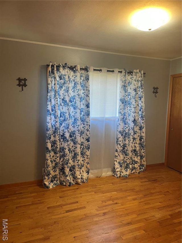 1415 Woodland Rd, Poplar Bluff, MO 63901 - unfurnished room featuring ornamental molding and wood finished floors