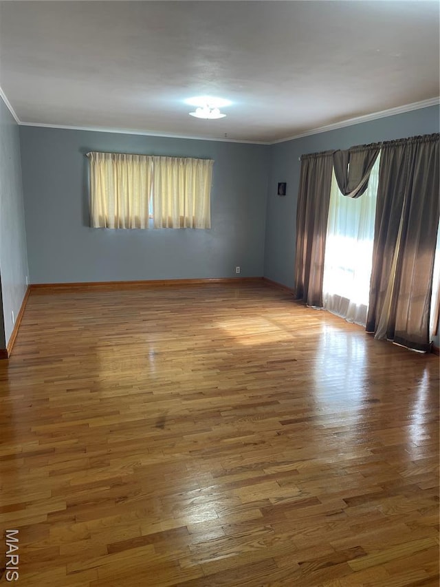 1415 Woodland Rd, Poplar Bluff, MO 63901 - empty room with ornamental molding and wood finished floors