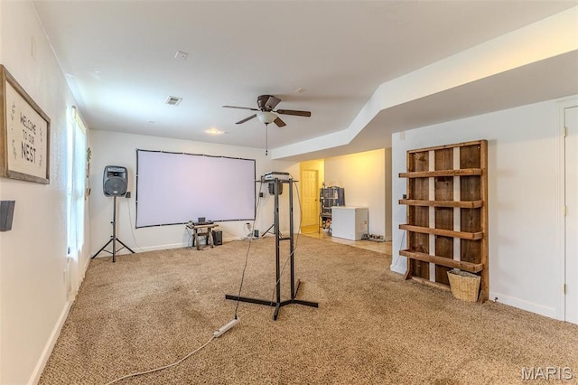 exercise area with ceiling fan, carpet flooring, and baseboards