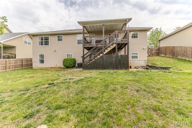 rear view of house with stairway, a wooden deck, and central AC