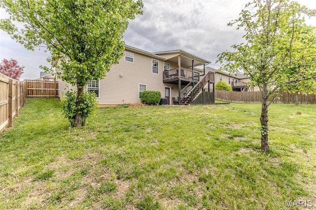 view of yard with stairway, a wooden deck, and central AC unit