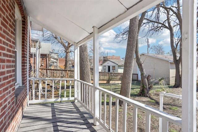 4644 Minnesota Ave, Saint Louis, MO 63111 - wooden deck featuring a residential view and fence